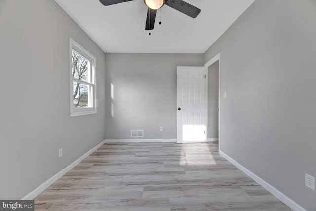 unfurnished room with ceiling fan and light hardwood / wood-style floors