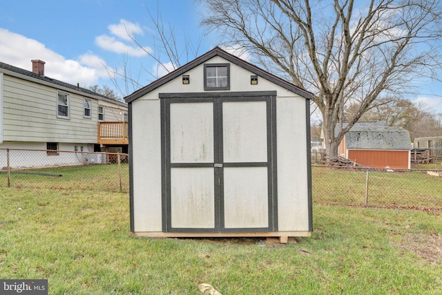 view of outbuilding with a lawn