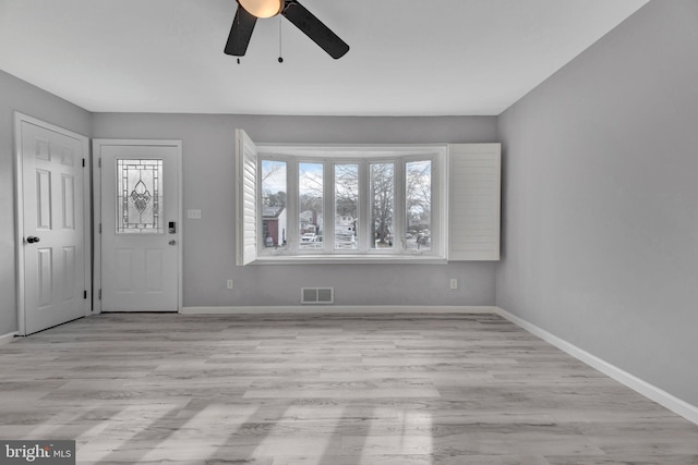 foyer featuring light hardwood / wood-style flooring and ceiling fan