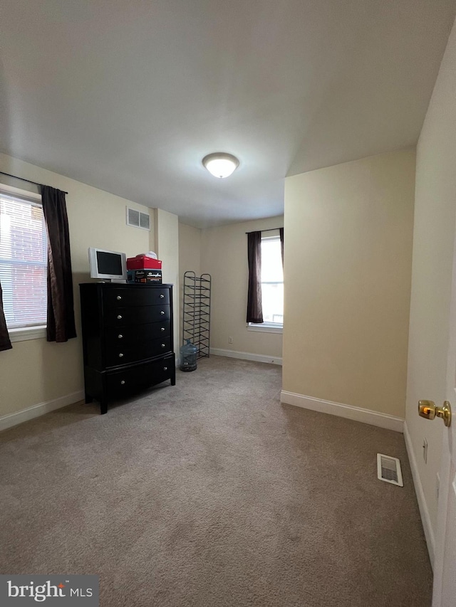 unfurnished bedroom featuring carpet