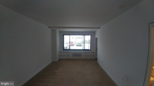 empty room with baseboards
