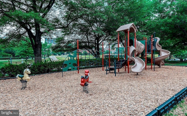 community jungle gym featuring fence