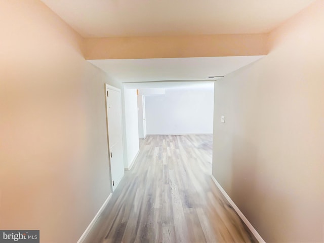 hallway with light hardwood / wood-style flooring