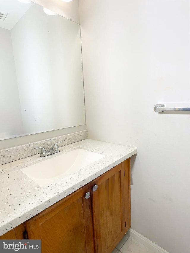 bathroom featuring vanity and tile patterned flooring