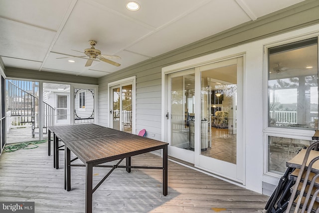 sunroom with ceiling fan