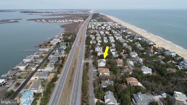 aerial view featuring a water view and a view of the beach