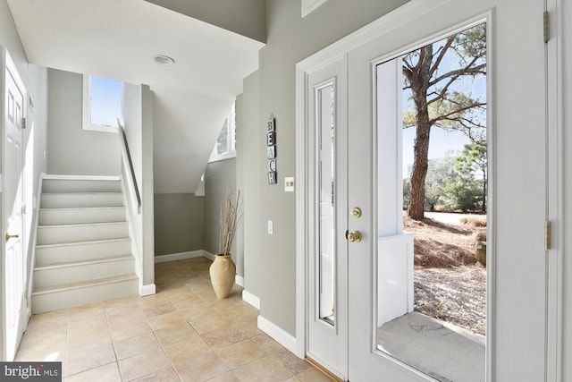 entryway featuring light tile patterned floors