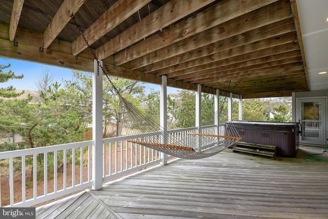 deck with a hot tub