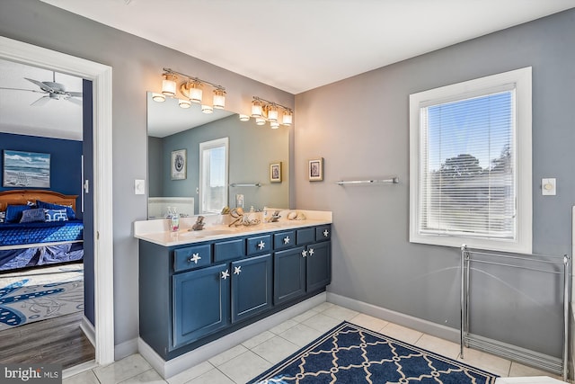 bathroom featuring vanity, ceiling fan, and tile patterned floors