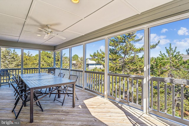 sunroom / solarium with ceiling fan and plenty of natural light