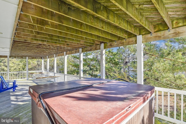 wooden terrace with a hot tub