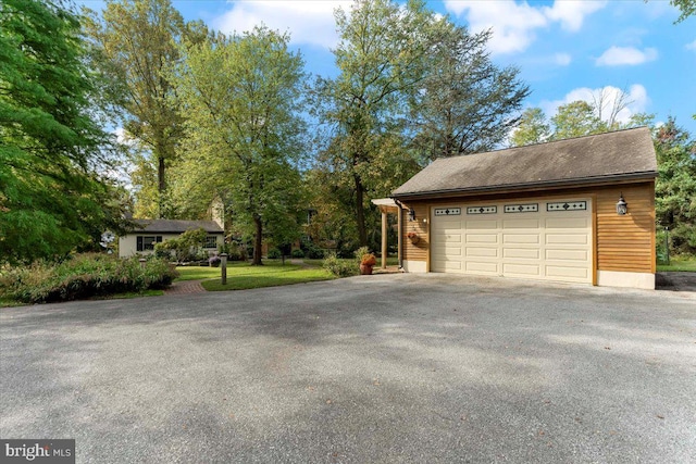 garage featuring a lawn