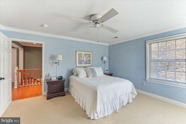 bedroom with crown molding, light carpet, and ceiling fan