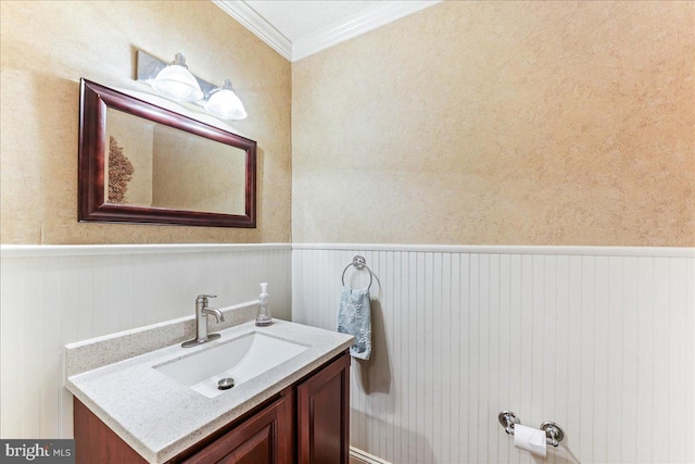 bathroom featuring vanity and ornamental molding