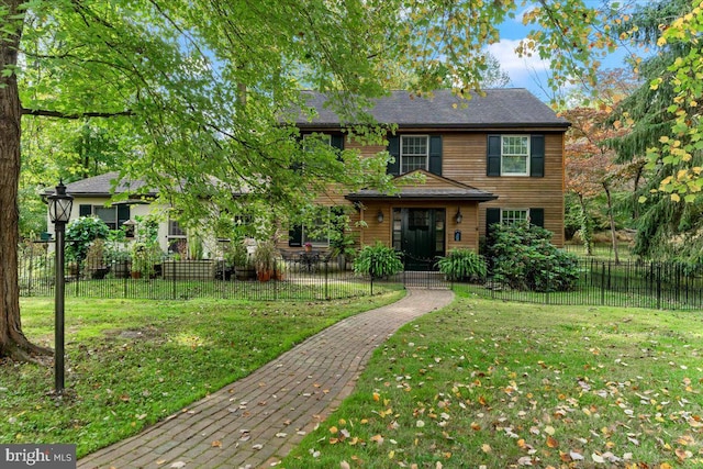 view of front of property with a front lawn