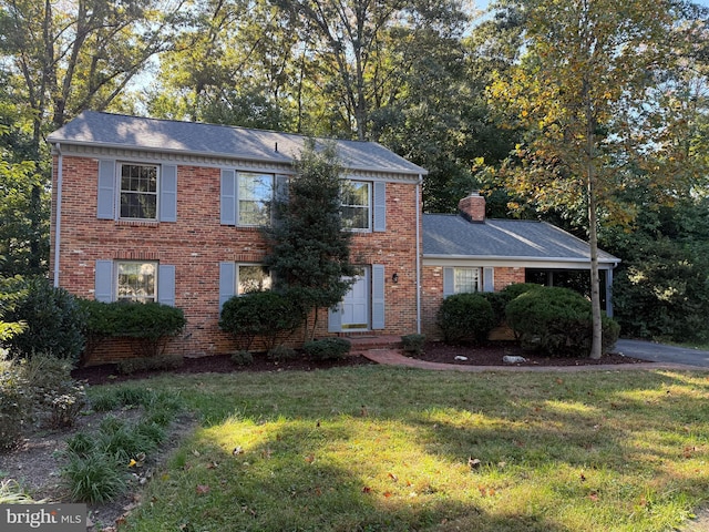 colonial home with a front lawn