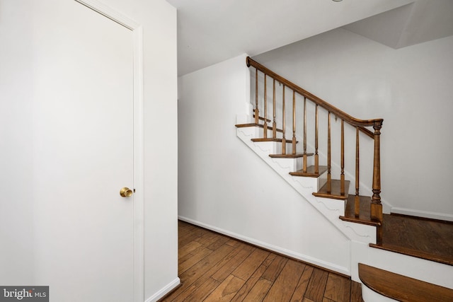 staircase featuring hardwood / wood-style flooring