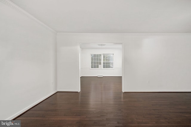 unfurnished room with dark hardwood / wood-style floors and ornamental molding