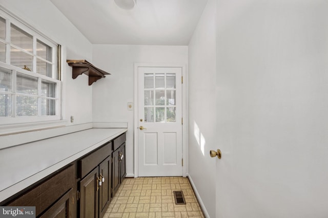 doorway to outside featuring a wealth of natural light