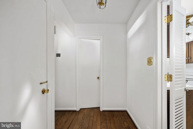 corridor with dark wood-type flooring