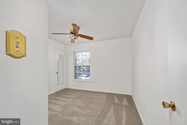 unfurnished room with ceiling fan and light colored carpet