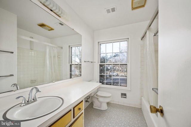 full bathroom with toilet, tile patterned flooring, vanity, and shower / tub combo with curtain