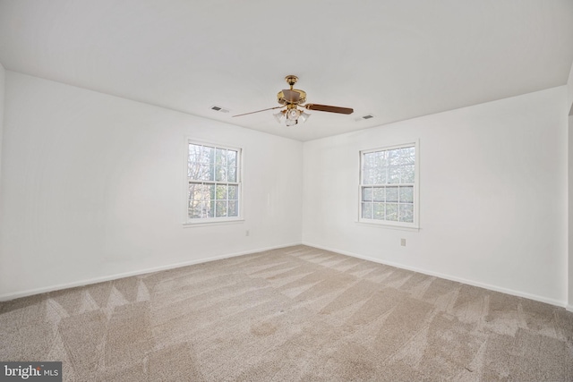 unfurnished room with carpet flooring and ceiling fan