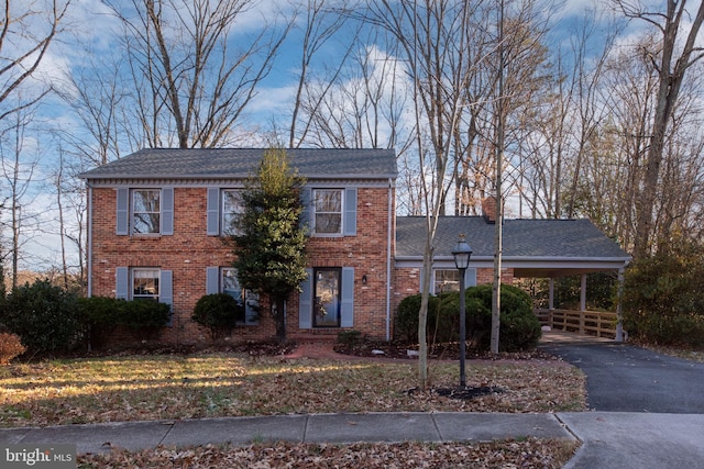 view of front of home featuring a carport