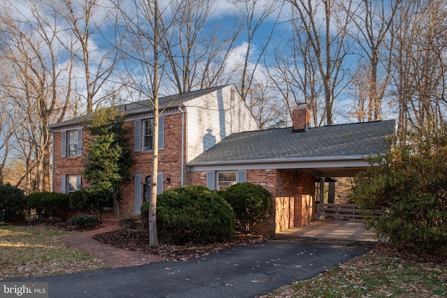 view of front facade with a carport