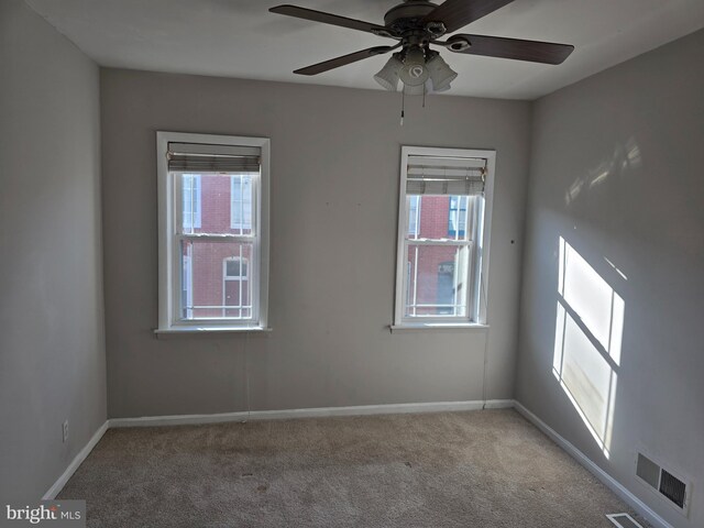 123 N Belnord Ave, Baltimore, MD 21224 - spare room with baseboards, light colored carpet, and a ceiling fan