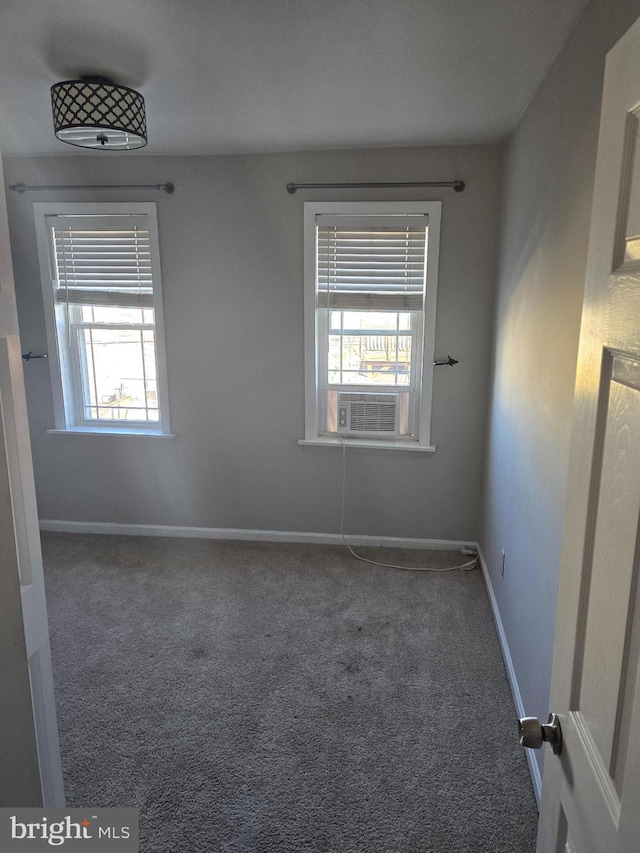 unfurnished room featuring carpet