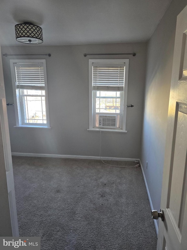 123 N Belnord Ave, Baltimore, MD 21224 - carpeted empty room featuring healthy amount of natural light and baseboards