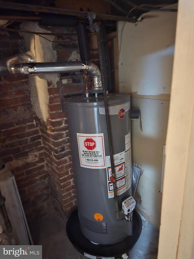 utility room with gas water heater