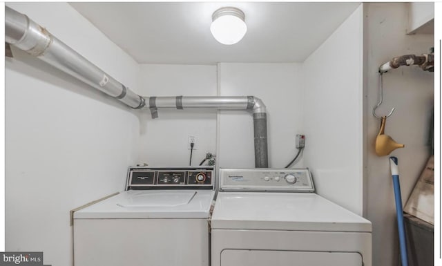 laundry area with separate washer and dryer