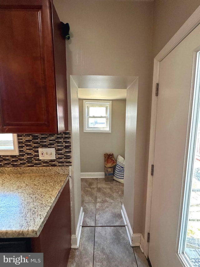 bathroom with backsplash and tile patterned flooring