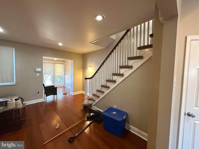 stairway featuring wood-type flooring