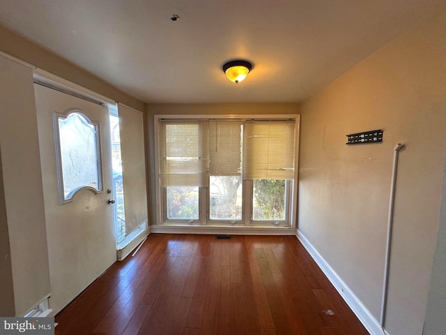 interior space with dark hardwood / wood-style flooring