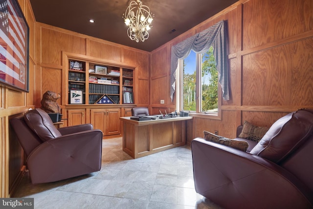 home office featuring wooden walls and a notable chandelier