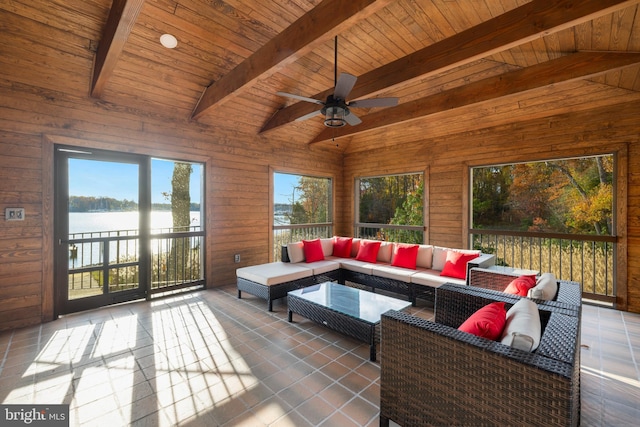 sunroom with vaulted ceiling with beams, a water view, and wood ceiling