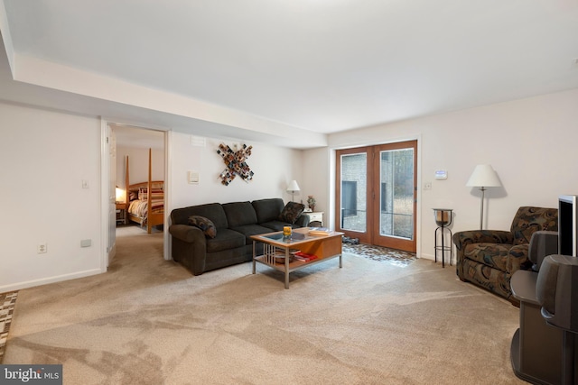 carpeted living room featuring french doors