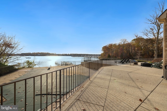 exterior space featuring a patio area and a water view