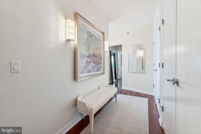 hallway with dark hardwood / wood-style floors