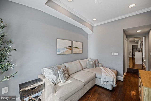 living room with crown molding and dark wood-type flooring