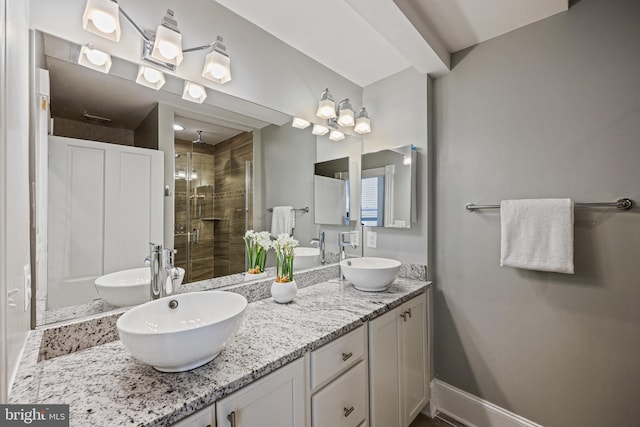 bathroom with vanity and an enclosed shower