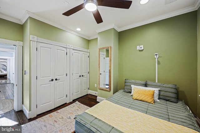 bedroom featuring ornamental molding, dark hardwood / wood-style floors, and ceiling fan