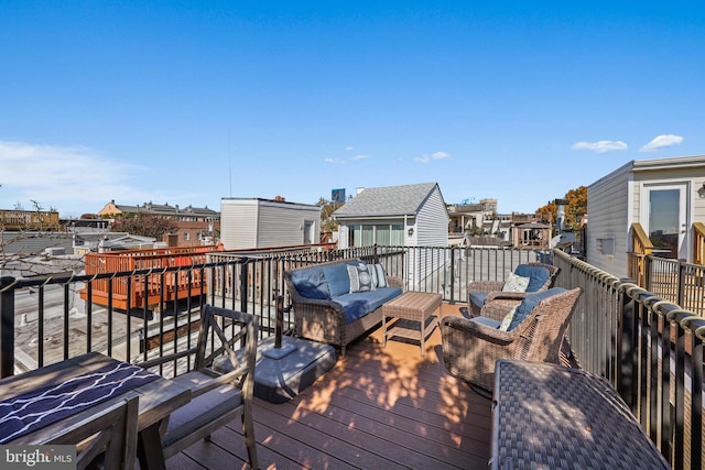 wooden terrace featuring outdoor lounge area