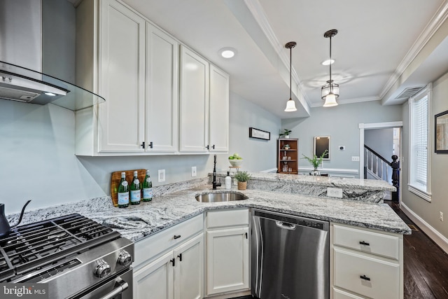 kitchen featuring wall chimney range hood, white cabinets, dark hardwood / wood-style flooring, sink, and stainless steel appliances