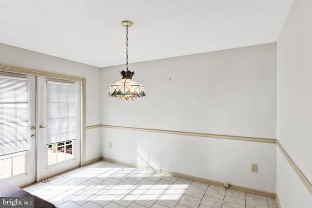 unfurnished dining area with french doors