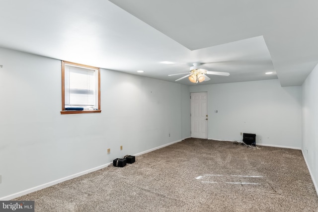 empty room with ceiling fan and carpet floors