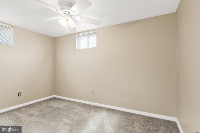 unfurnished room with light colored carpet and ceiling fan